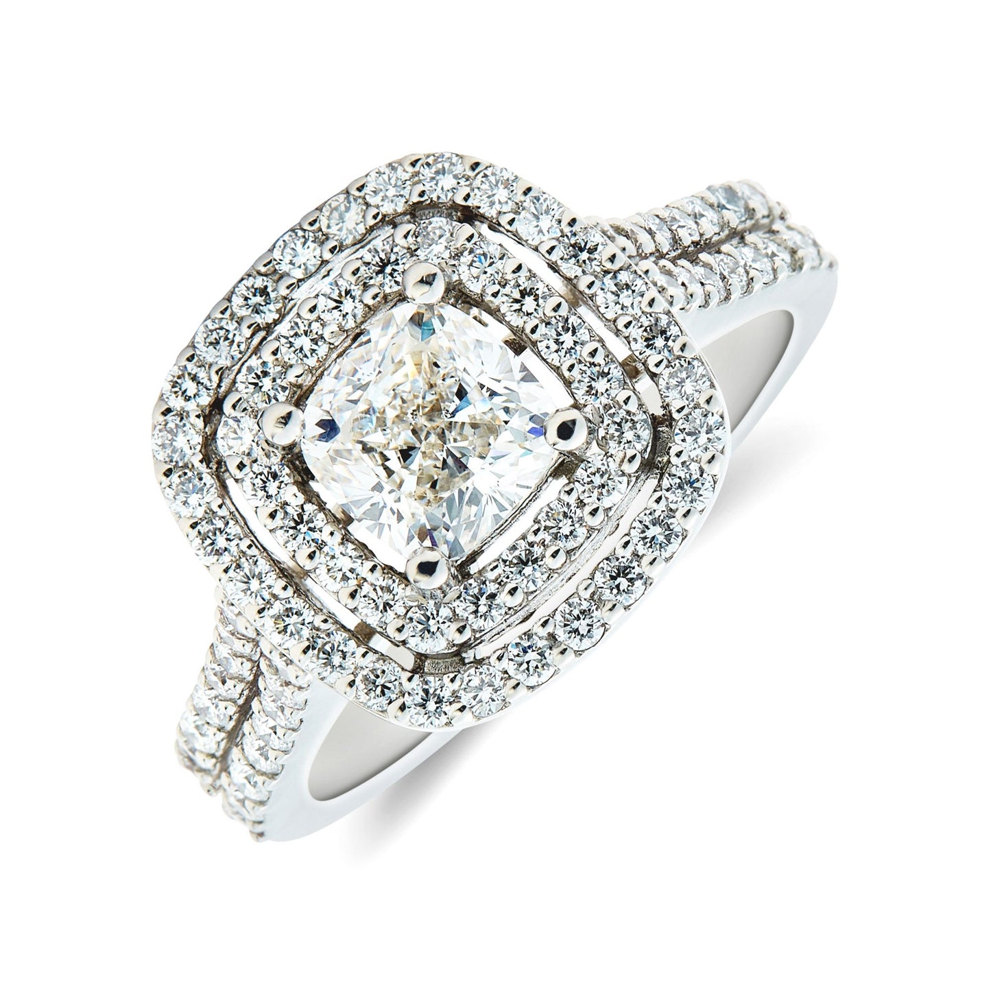 Platinum & cushion cut diamond cluster ring surround of double row diamond set halo. Henry D Johnstone Jewellers. Alderley Edge, Poynton, Cheshire.