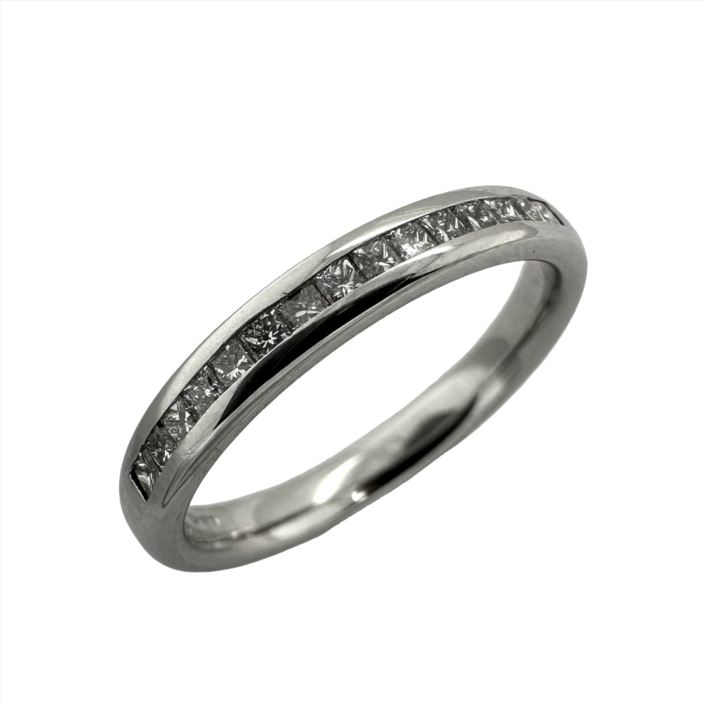 Precious white metal set with princess cut diamonds in channel setting. Henry D Johnstone Jewellers. Alderley Edge, Poynton, Cheshire.