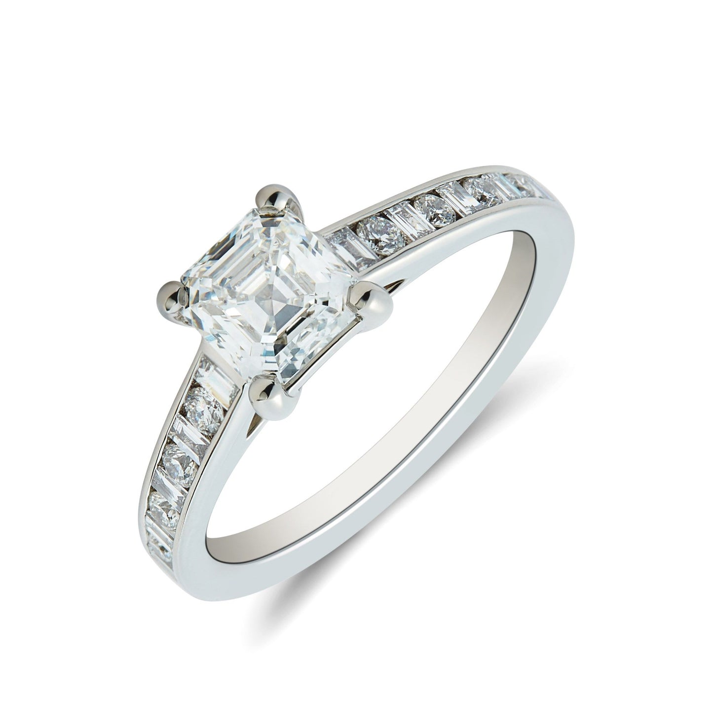 Platinum & Ascher cut diamond solitaire rind with inset round brilliant & baguette cut diamond shoulders. Henry D Johnstone Jewellers. Alderley Edge, Poynton, Cheshire.