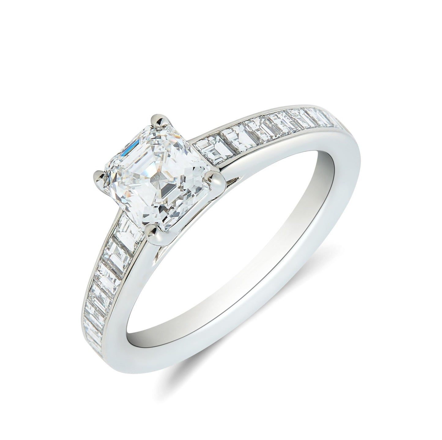 Platinum & Ascher cut diamond solitaire ring with carre cut diamond inset shoulders. Henry D Johnstone Jewellers. Alderley Edge, Poynton, Cheshire.
