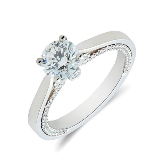Platinum & round brilliant cut diamond solitaire ring with open shoulders and diamond set sides. Henry D Johnstone Jewellers. Alderley Edge, Poynton, Cheshire.