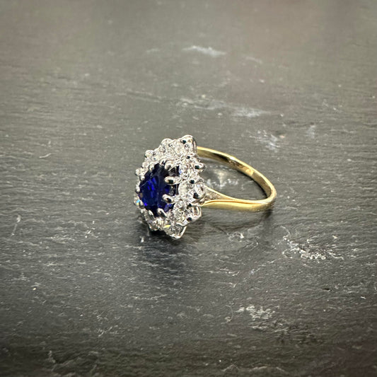 Pre-Owned: Precious yellow metal sapphire ring with diamond set surround  - 1.04ct