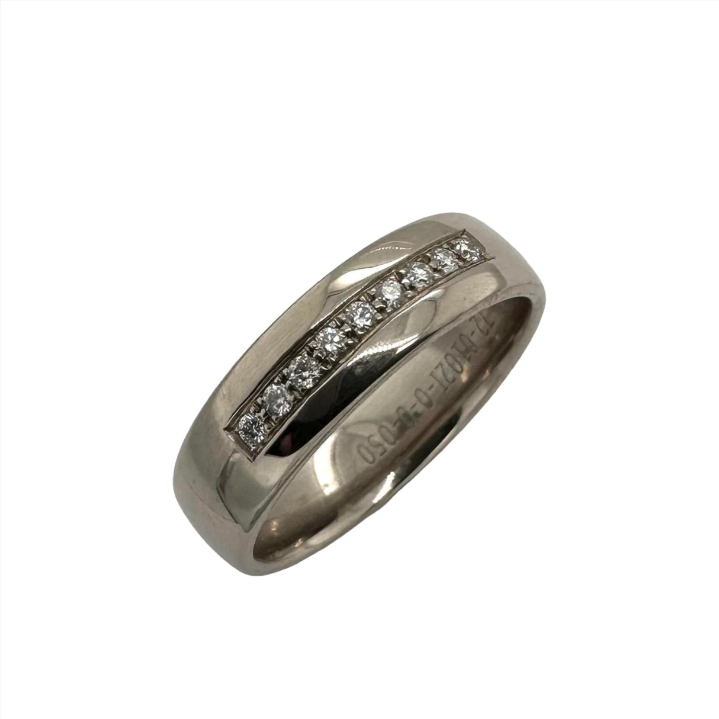 Precious white metal ring with round brilliant cut diamonds in a milligrain setting. Henry D Johnstone Jewellers. Alderley Edge, Poynton, Cheshire.