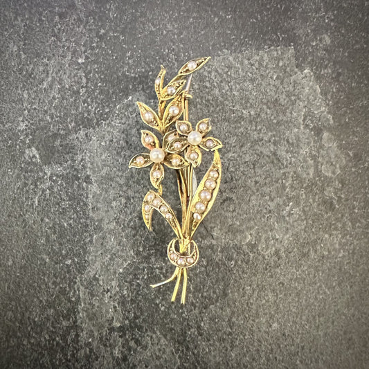 Pre-Owned: Precious yellow metal floral style brooch set with seed pearls.