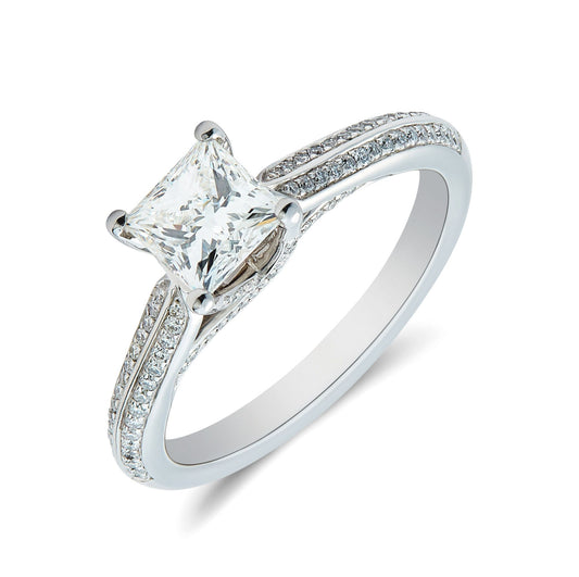Platinum & princess cut diamond solitaire ring with diamond grain set knife edge shoulder. Henry D Johnstone Jewellers. Alderley Edge, Poynton, Cheshire.