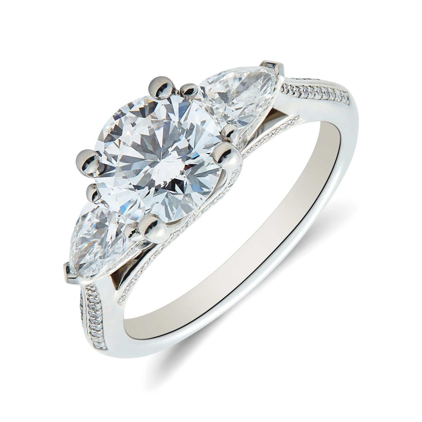 Bespoke platinum round brilliant & pear cut diamond trilogy ring. Henry D Johnstone Jewellers. Alderley Edge, Poynton, Cheshire.