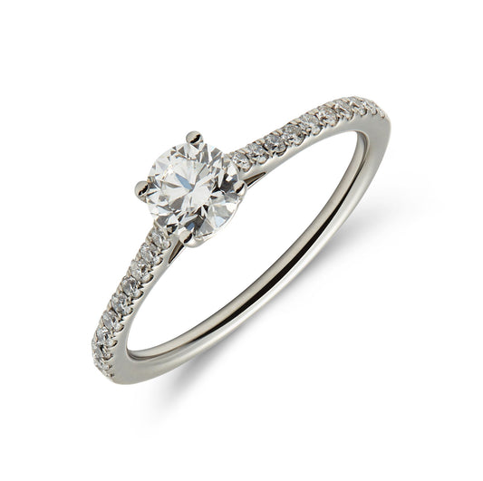 Platinum & round brilliant cut diamond solitaire ring with diamond set shoulders. Henry D Johnstone Jewellers. Alderley Edge, Poynton, Cheshire.