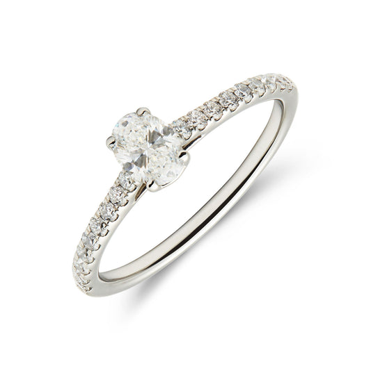 Platinum and oval diamond set solitaire ring with diamond set shoulders. Henry D Johnstone Jewellers. Alderley Edge, Poynton, Cheshire.