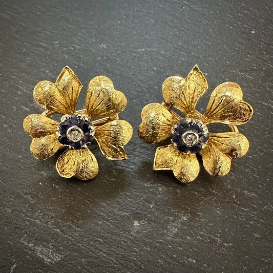 - Pre owned precious yellow metal floral clip on earrings with sapphire cluster with a diamond centre.