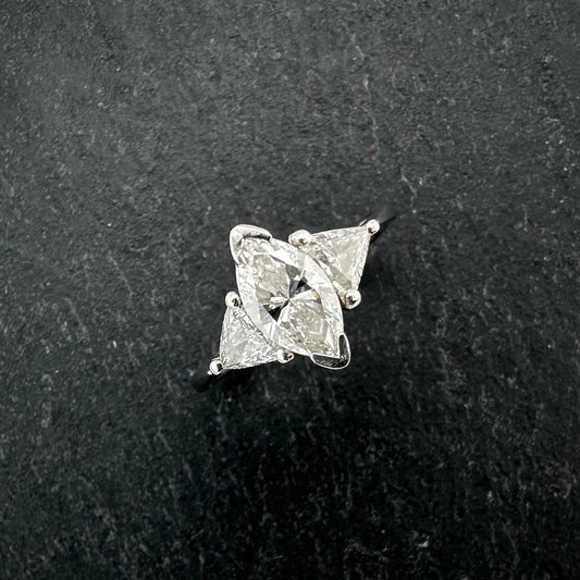 Pre-Owned: Platinum marquis & trilliant cut diamond claw set trilogy ring.