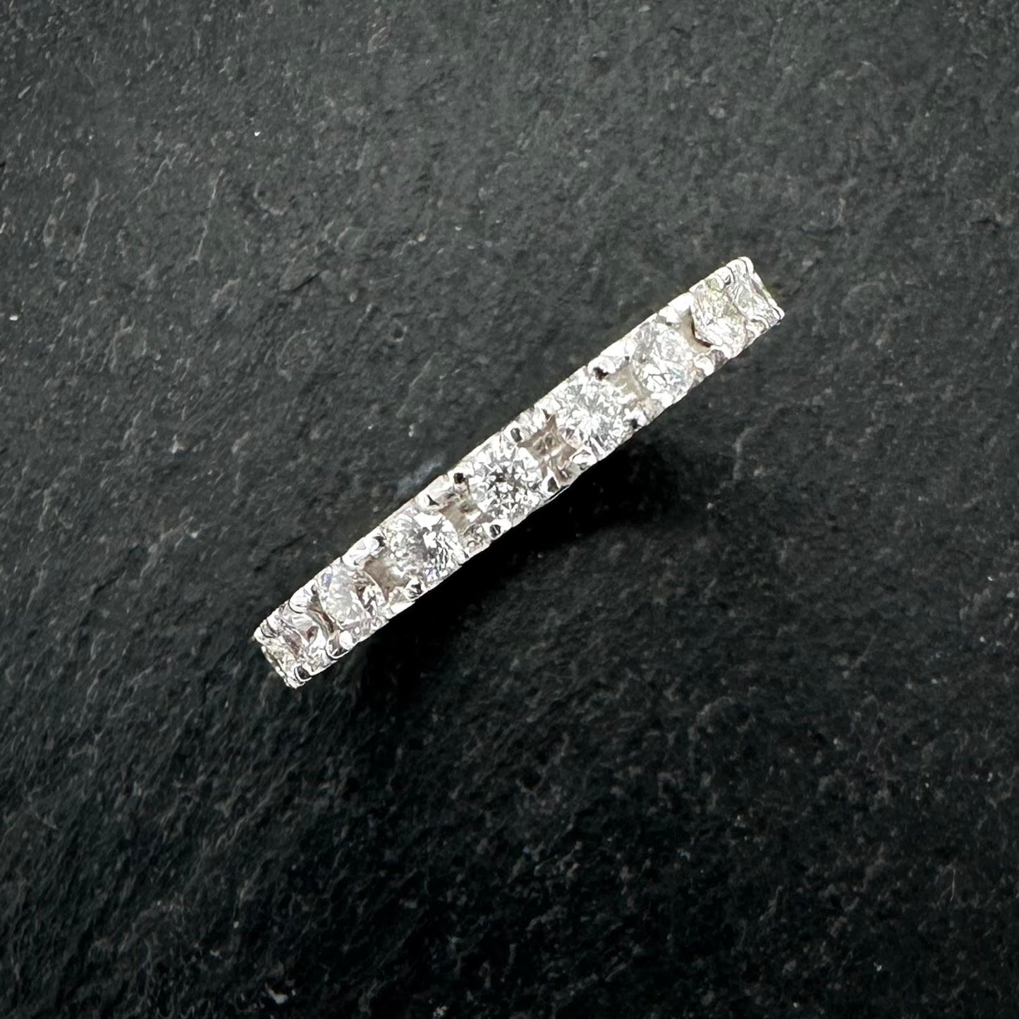 Pre-Owned: Precious white metal round brilliant cut diamond set eternity ring - Full hoop.