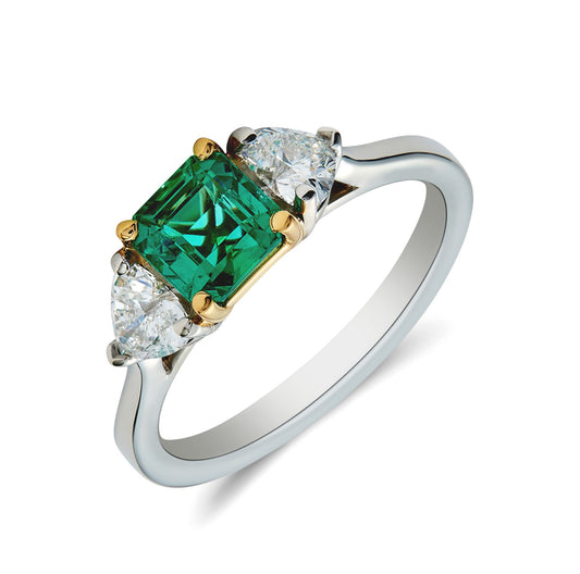 Platinum & 18 yellow gold diamond emerald three stone ring. Henry D Johnstone Jewellers. Alderley Edge, Poynton, Cheshire.