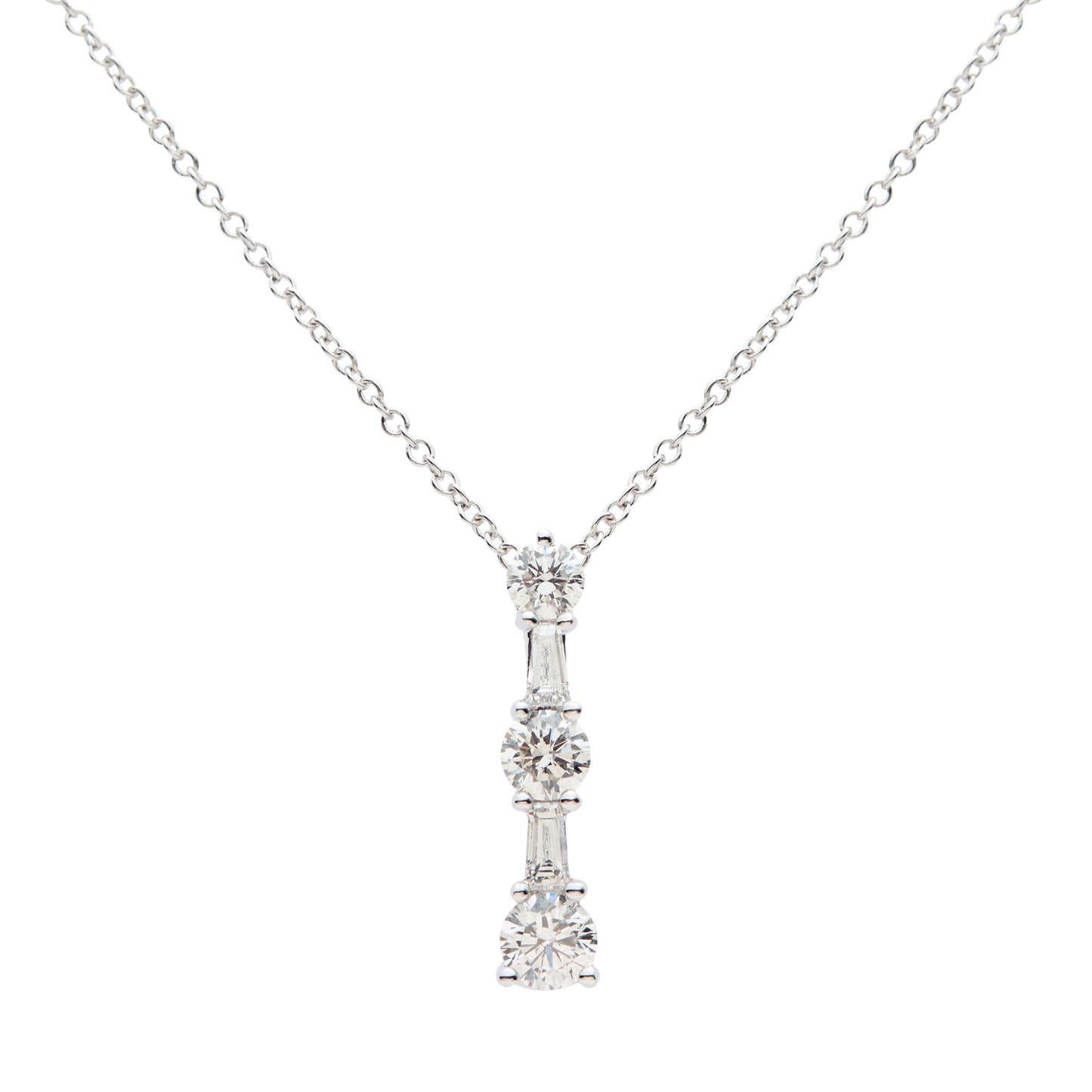 18ct white gold round brilliant cut and tapered baguette diamond drop pendant. Henry D Johnstone Jewellers, Alderley Edge, Poynton, Cheshire.