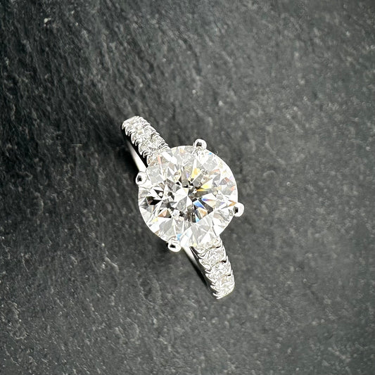 Pre-Owned: One 18ct white gold round brilliant cut diamond solitaire ring with diamond set shoulders 2.30ct