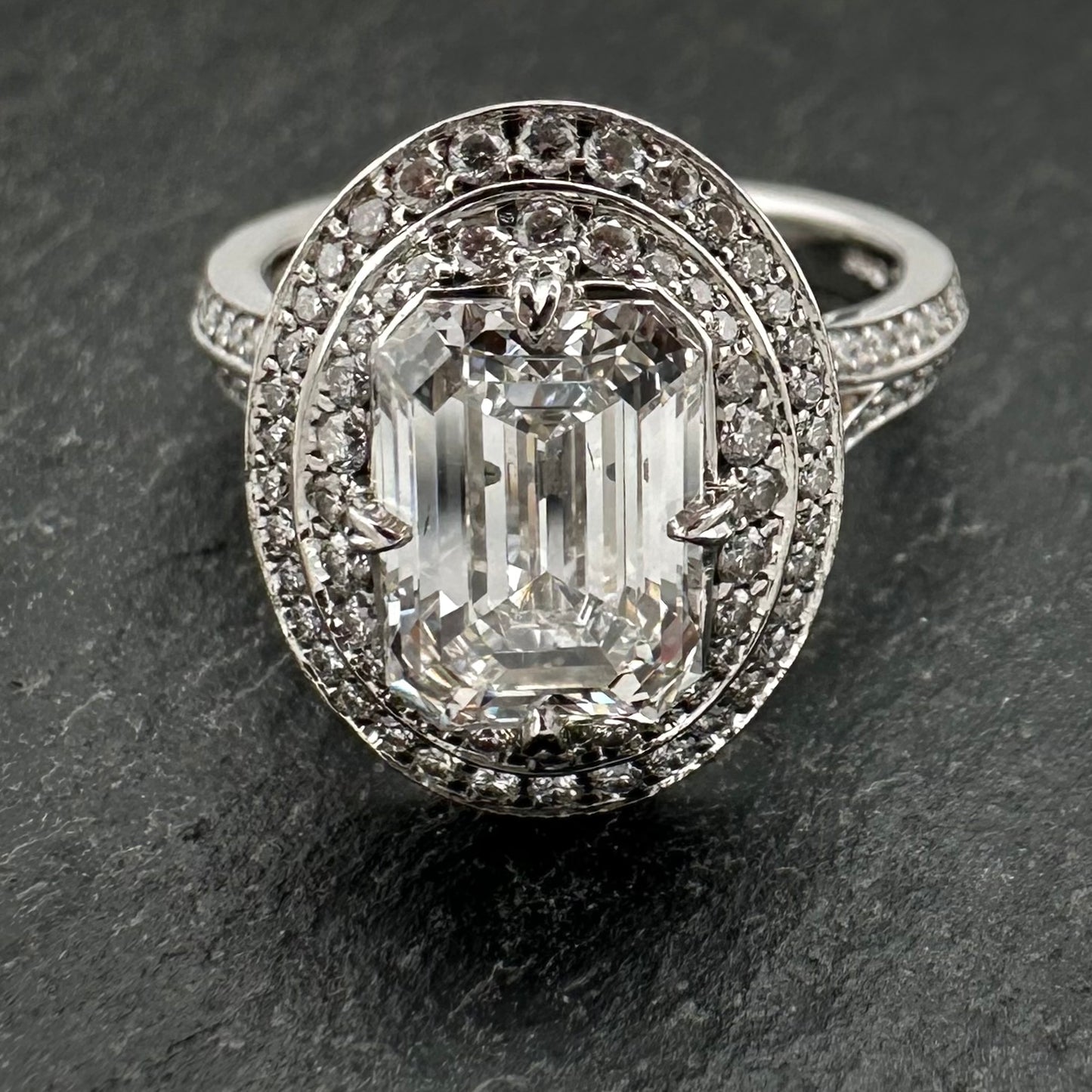 Pre-Owned: Platinum emerald cut diamond solitaire ring with diamond set double halo - 2.03ct