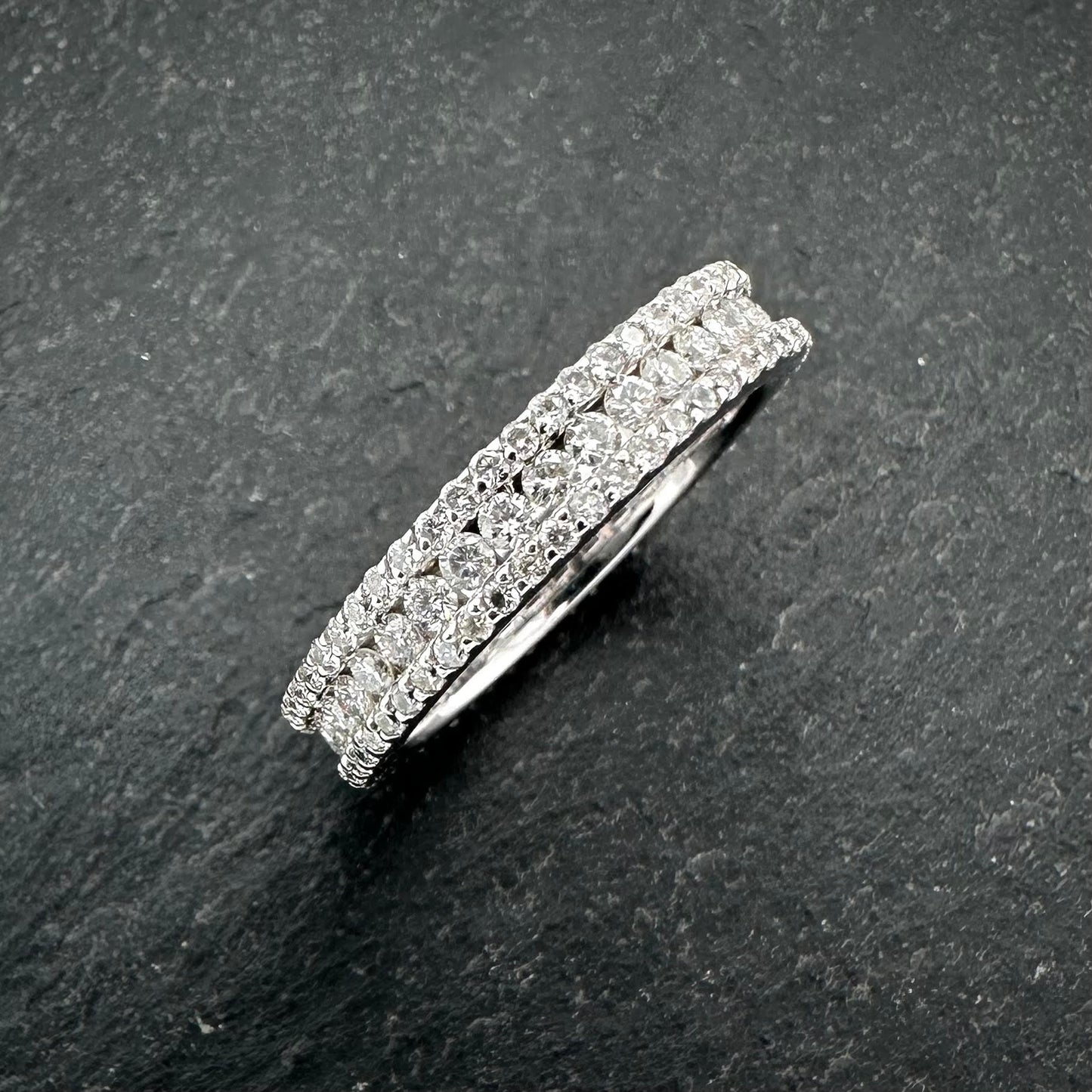Pre-Owned: Precious white metal round brilliant cut diamond set channel eternity ring - Full hoop.