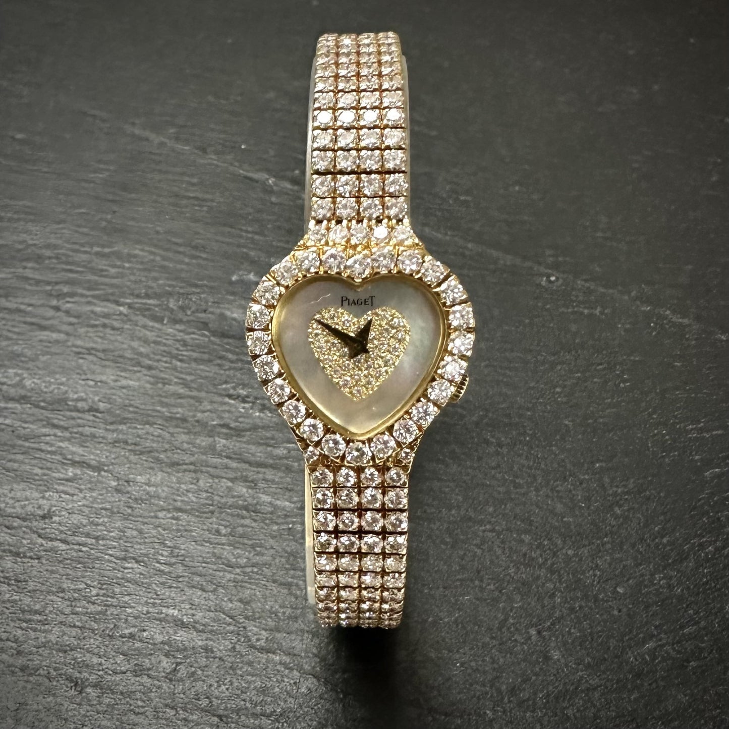 Piaget 18ct yellow gold heart shaped diamond set quartz ladies watch. Henry D Johnstone Jewellers. Alderley Edge, Poynton, Cheshire.