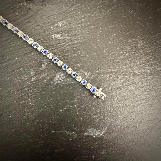 Pre-Owned: Precious white metal Diamond & Sapphire line bracelet.