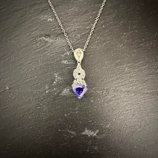 Pre-Owned: 18ct white gold heart shaped cut Tanzanite pendant with diamond set bail & drop. 3.52ct
