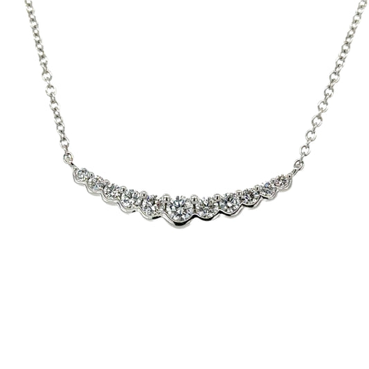 18ct white gold 11 stone diamond graduated curved bar pendant on chain.