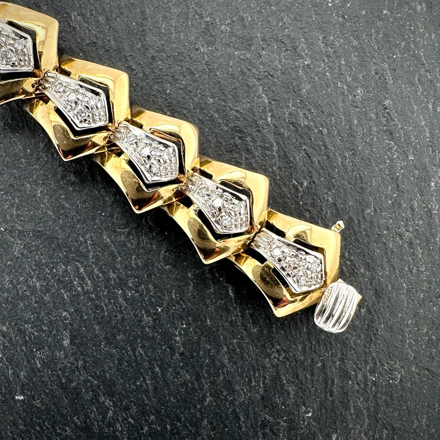Pre-Owned: 18ct yellow & white gold diamond set fancy bracelet with box snap fastener and figure of eight clasp. 0.50ct