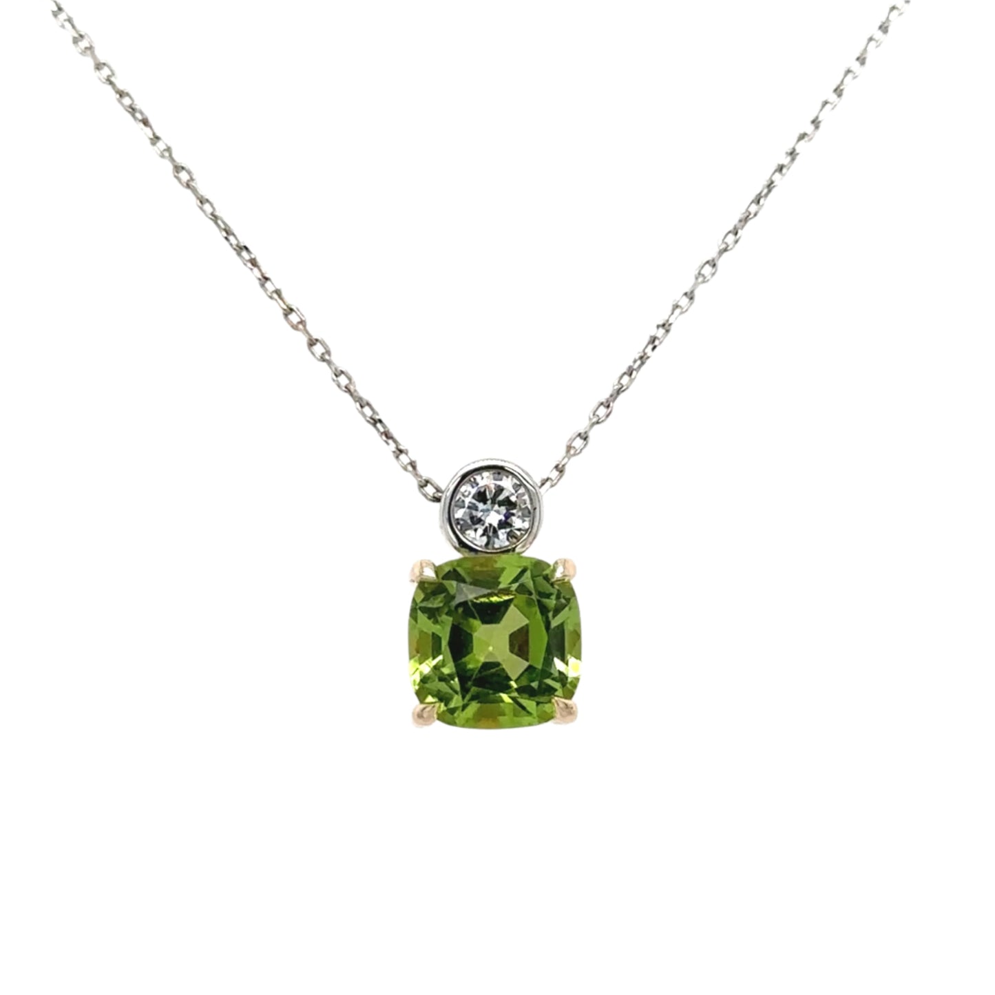 9ct yellow & white gold cushion cut peridot brilliant cut diamond pendant on fine trace chain.