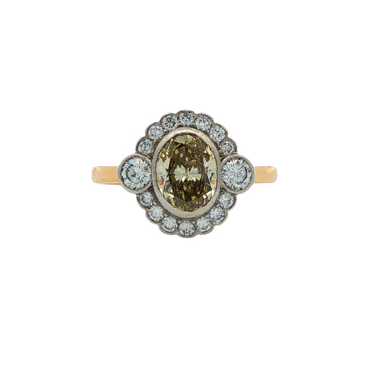 Pre-Owned: One 18ct yellow & white gold oval cut champagne diamond cluster ring.