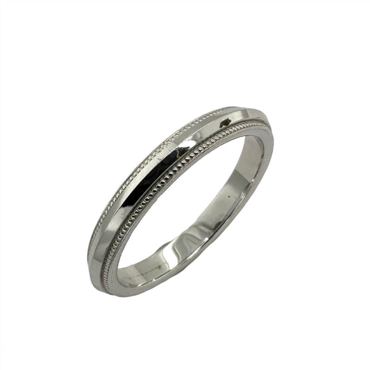 18ct white gold diamond cut wedding band with milled edges. Henry D Johnstone Jewellers. Alderley Edge, Poynton, Cheshire.