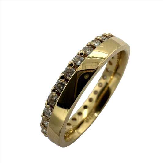 18ct yellow gold round brilliant cut offset diamond wedding band . Henry D Johnstone Jewellers. Alderley Edge, Poynton, Cheshire.