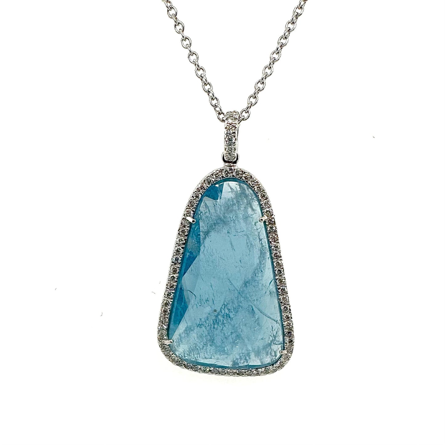 18ct White gold Aquamarine "Slice" pendant with diamond surround.