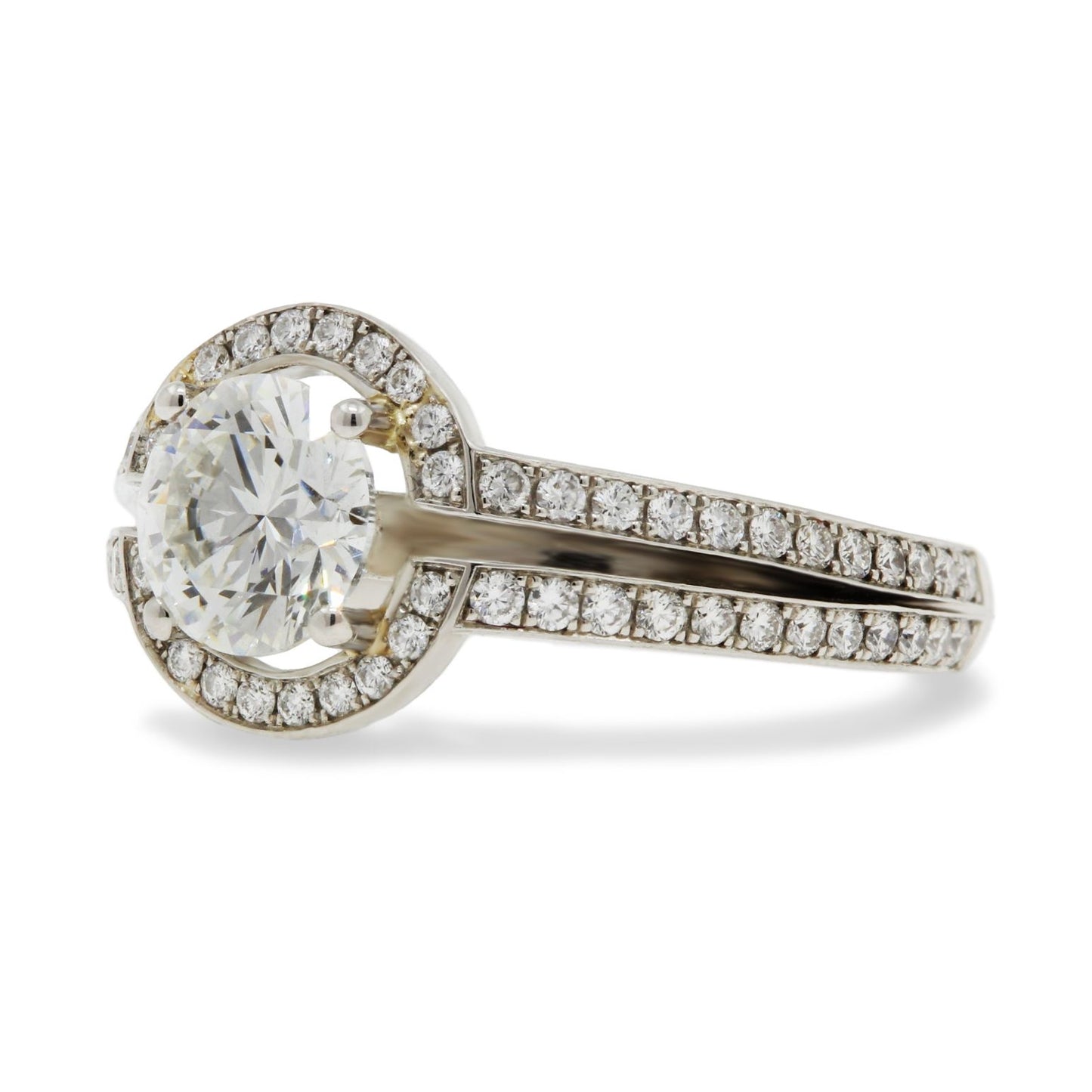 Platinum round brilliant cut diamond solitaire ring grain set surround & open split shoulders - 1.01ct