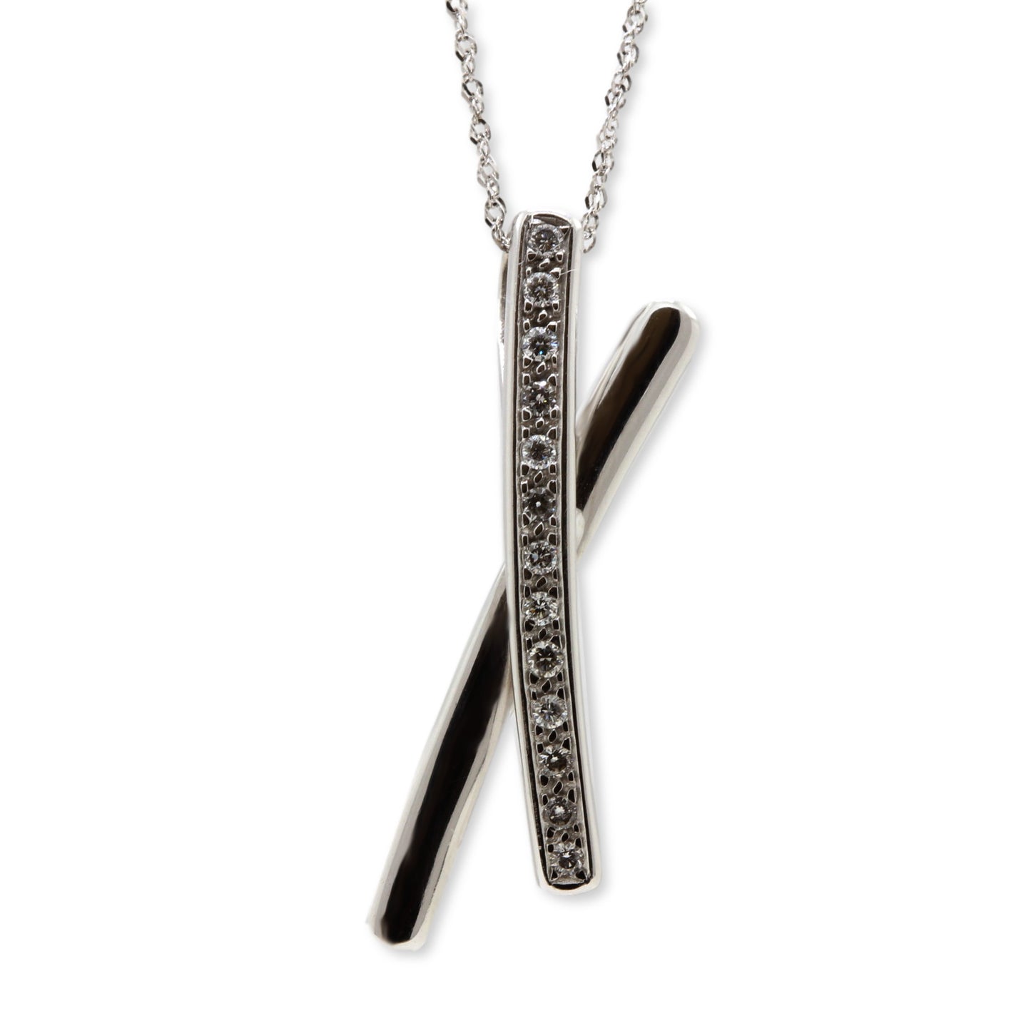 18ct white gold diamond set 'Kiss' shape pendant suspended on chain. Henry D Johnstone Jewellers, Alderley Edge, Poynton, Cheshire.