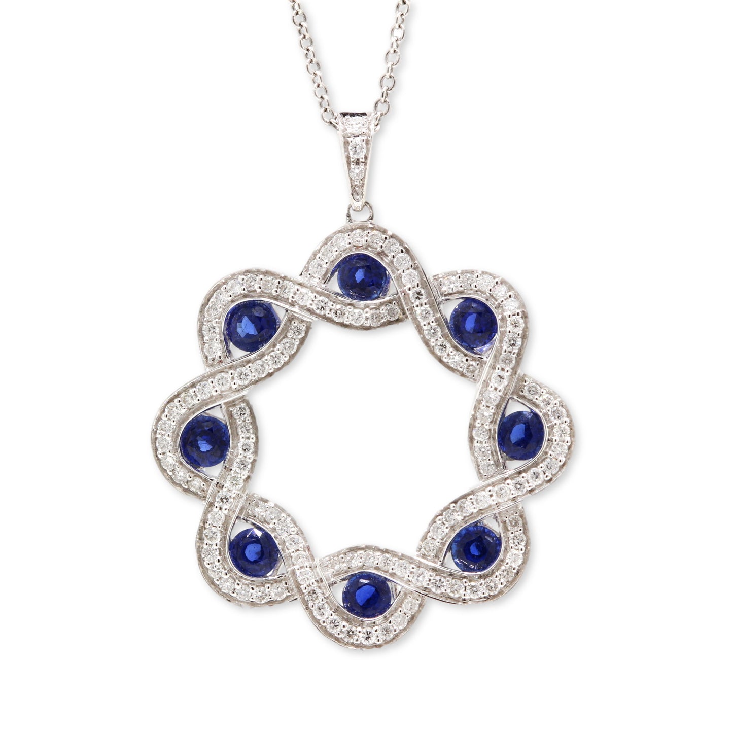 18ct white gold sapphire & diamond plaited circle pendant. Henry D Johnstone Jewellers, Alderley Edge, Poynton, Cheshire.