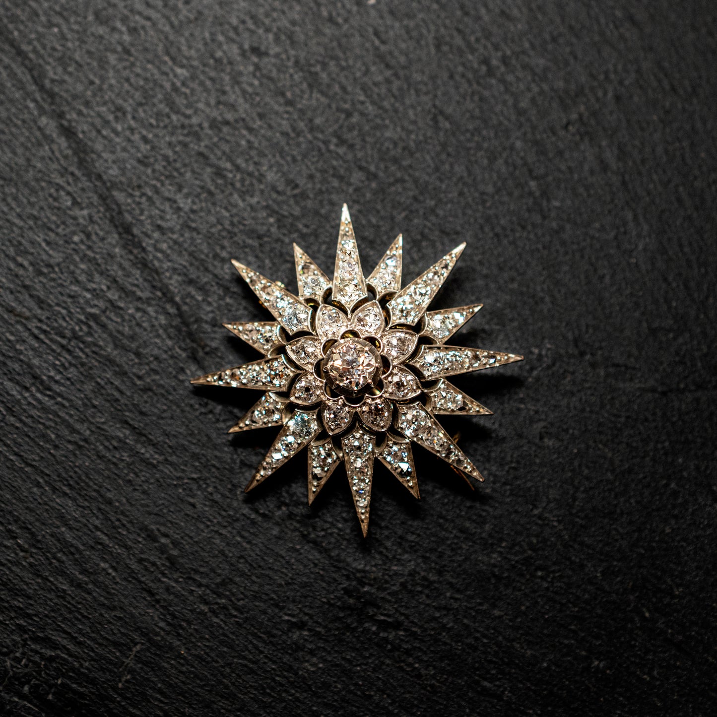 Eight ray star brooch, Diamond Encrusted, With Detachable Brooch Pin And Fixed Hanging.