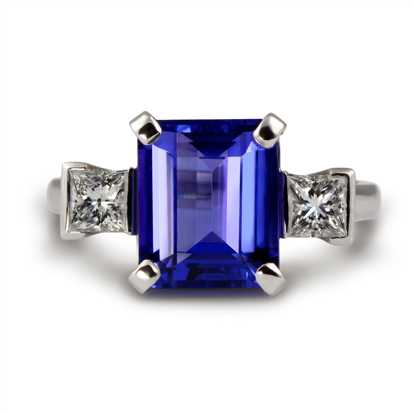 Bespoke: 18ct Emerald cut Tanzanite with Princess cut diamond Three Stone Ring.