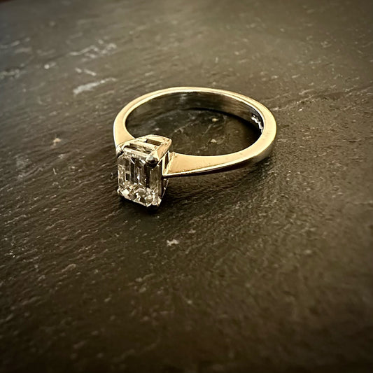 Pre-Owned: One platinum emerald cut diamond solitaire ring - 1.09ct.