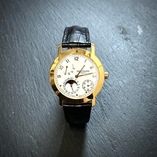 Pre-Owned: 18ct yellow gold Patek phillipe 5055J-001 'Calatrava Moonphase' leather strap watch.