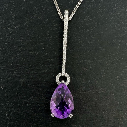 Pre-Owned: One 18ct white gold amethyst and diamond drop pendant.