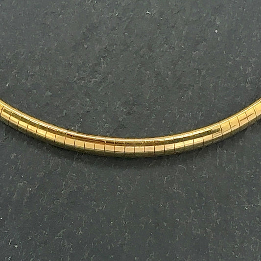 Pre-Owned: One precious yellow metal 'Omega' mirror collar necklace.