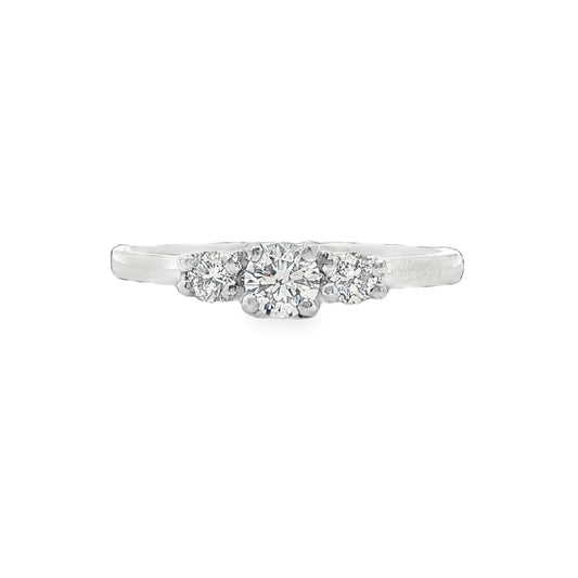 Platinum & round round brilliant cut diamond three stone ring - 0.33ct