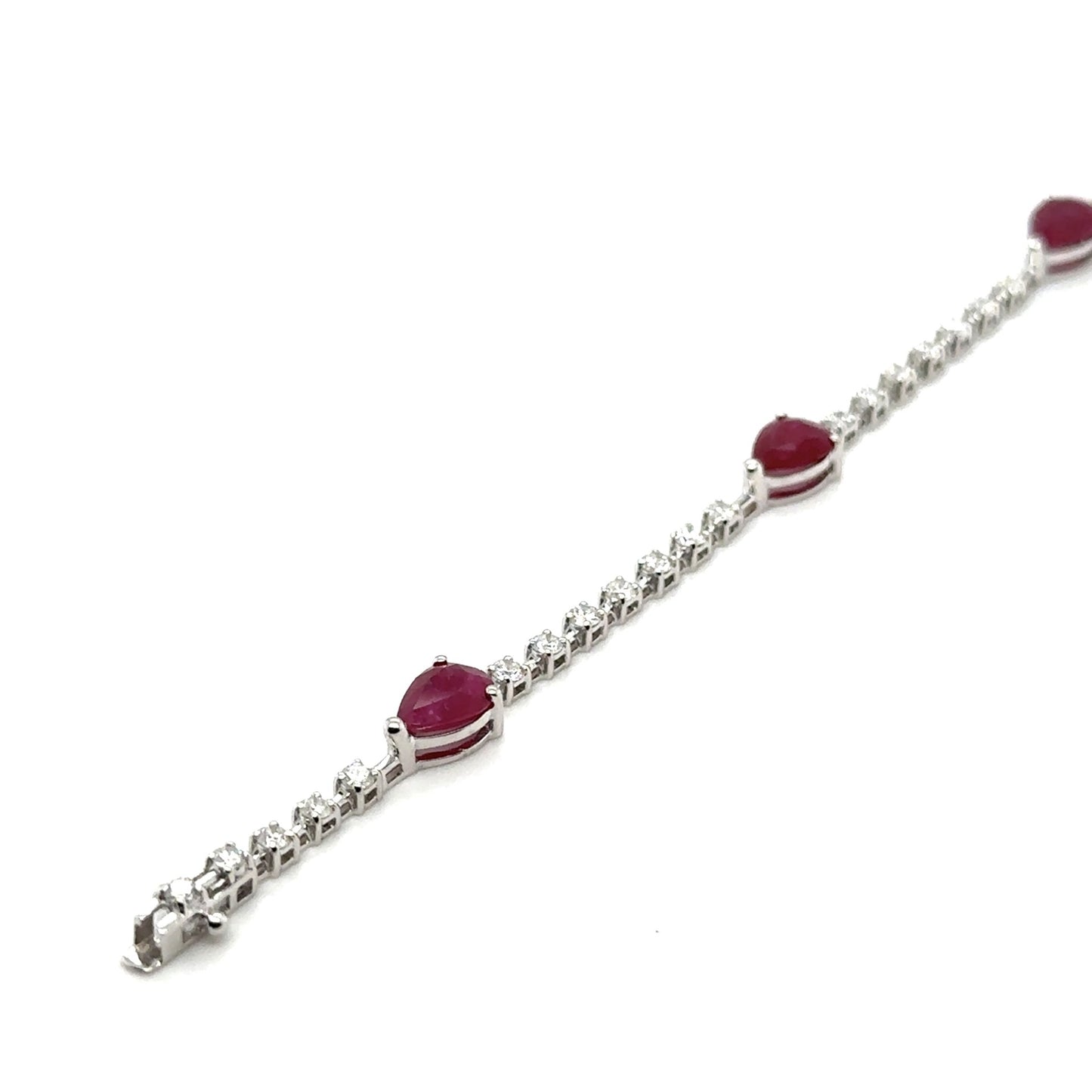 9ct White gold pear shape ruby and diamond line bracelet- R:3.66ct/D:1.20ct