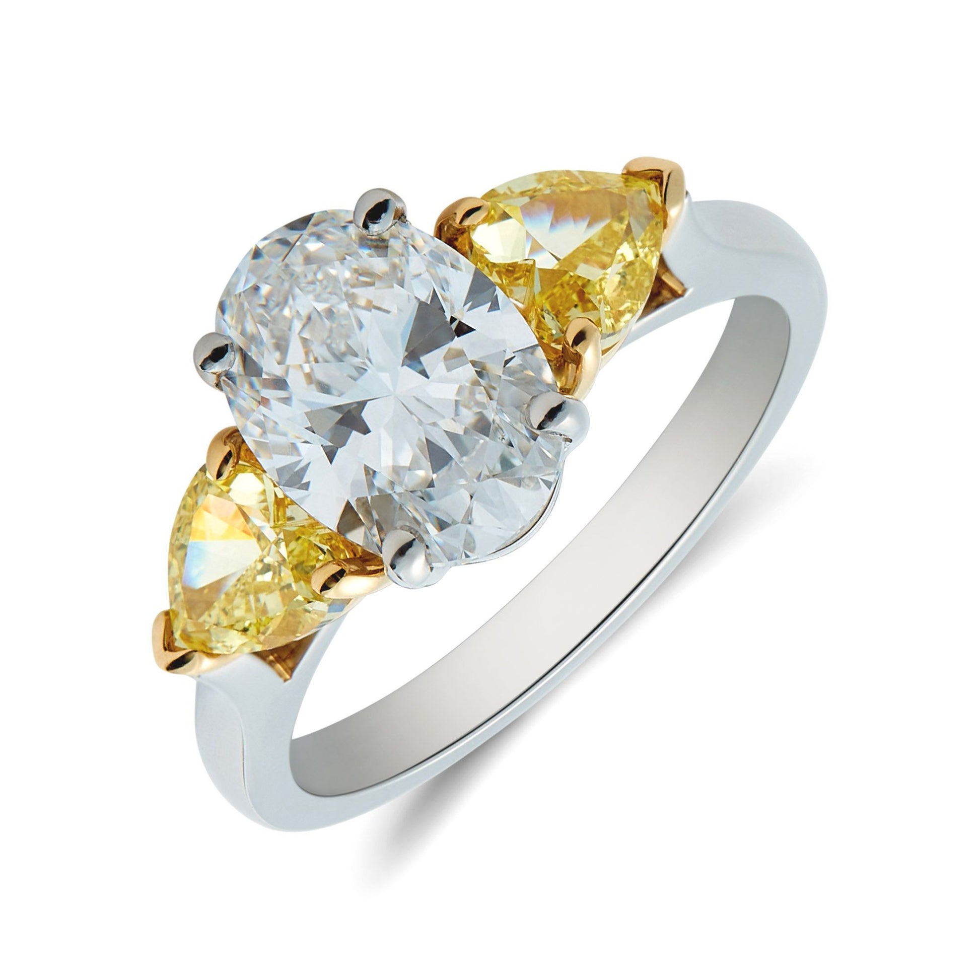 Platinum & 18ct yellow gold oval & heart shaped diamond trilogy ring. Henry D Johnstone Jewellers. Alderley Edge, Poynton, Cheshire.