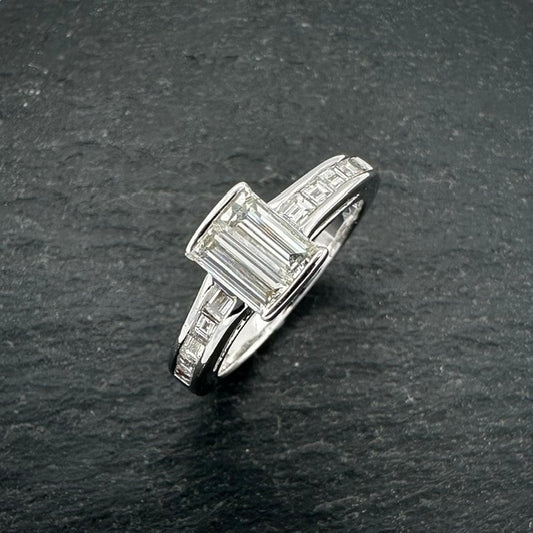 Pre-Owned: Precious white metal baguette & carre cut diamond set ring.