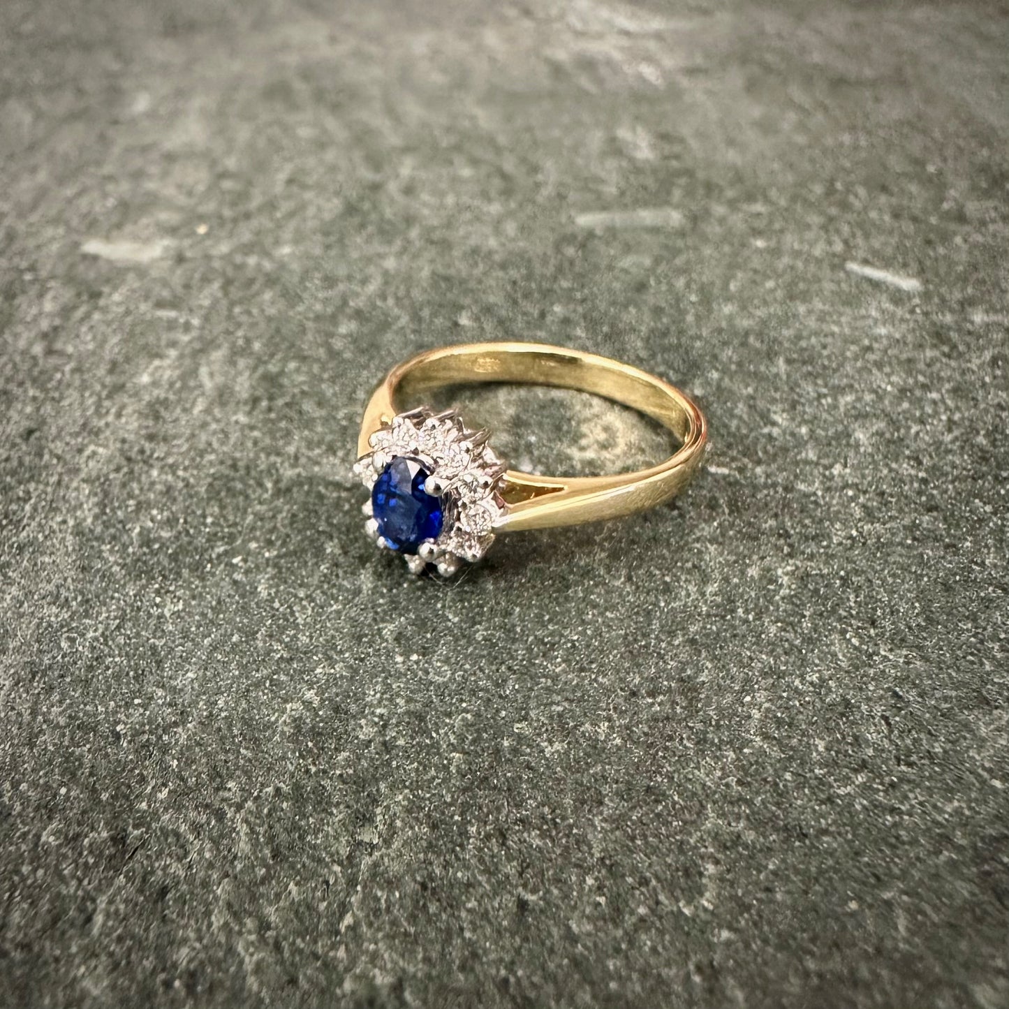 Pre Owned: 18ct gold oval sapphire and brilliant cut diamond cluster ring.  - 0.45ct