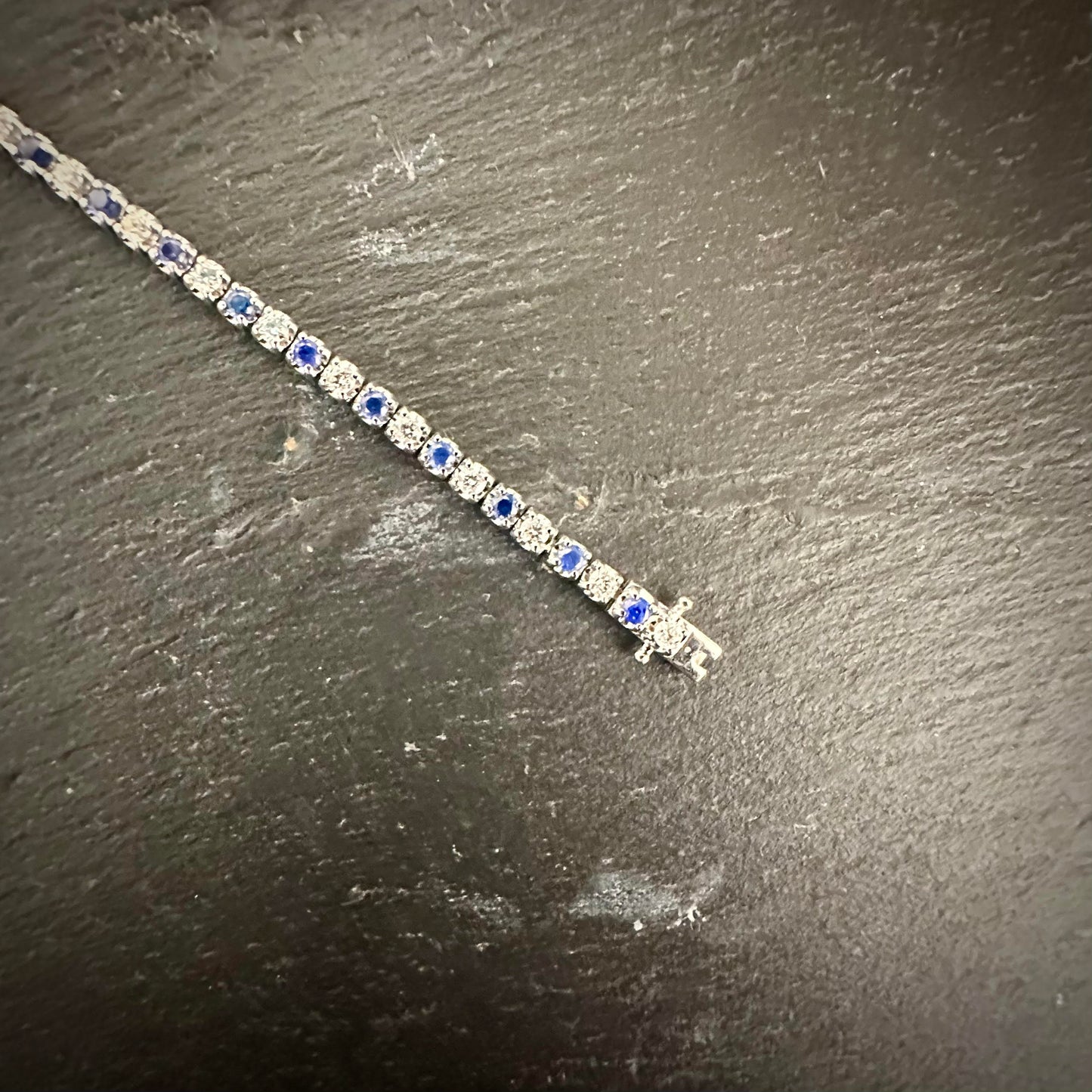 Pre-Owned: Precious white metal Diamond & Sapphire line bracelet.