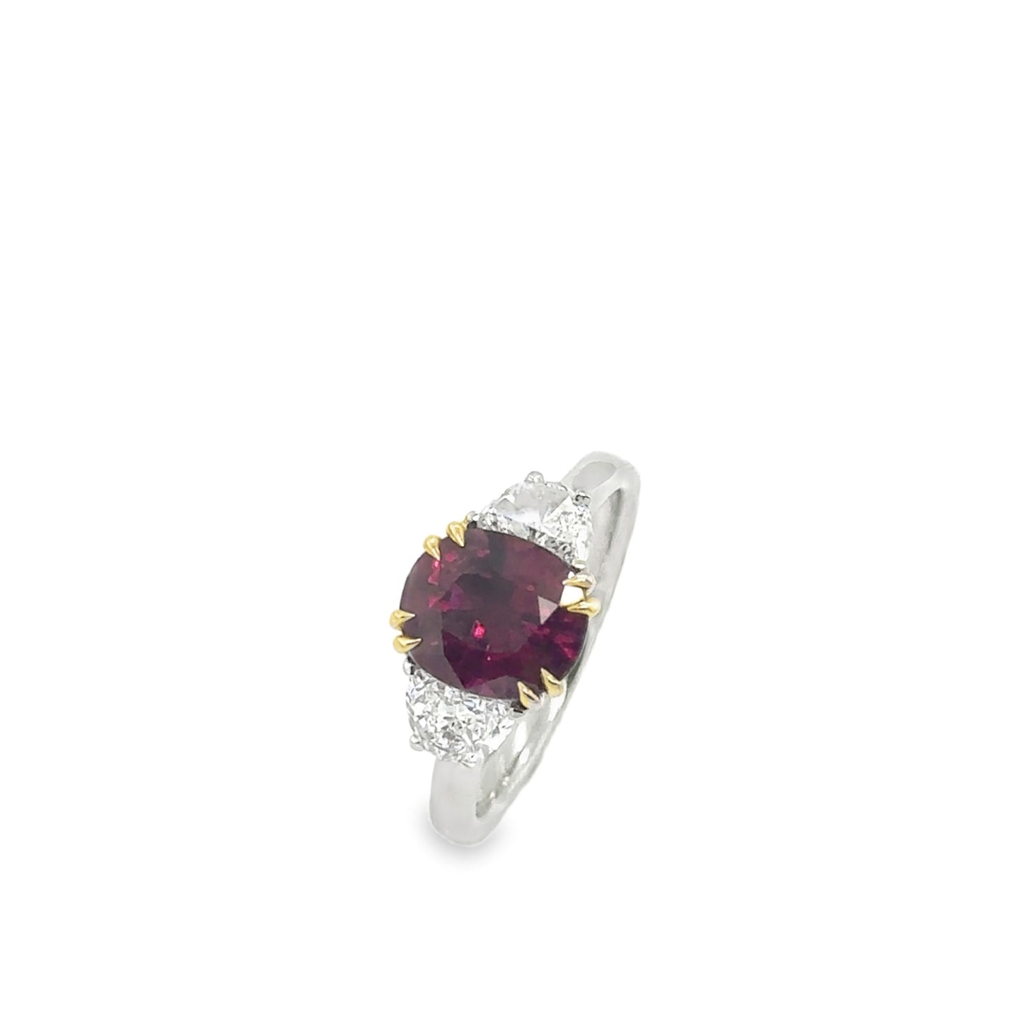 Bespoke: One platinum & 18ct yellow Siam ruby and diamond three stone ring - R2.68ct / D0.70ct.