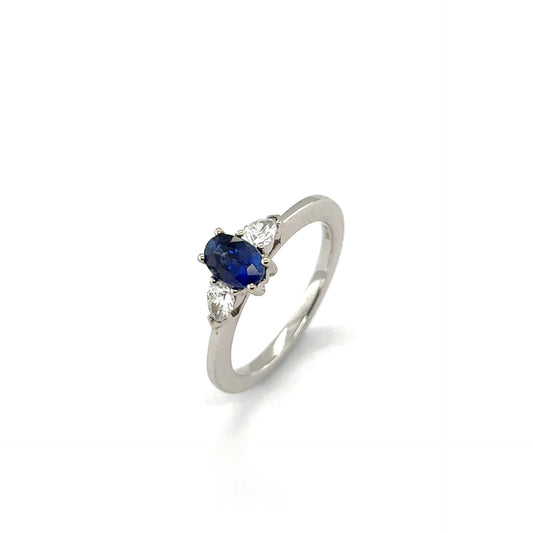 18ct white gold oval blue sapphire and pear cut diamond 3st ring - S0.74ct/D0.27ct.