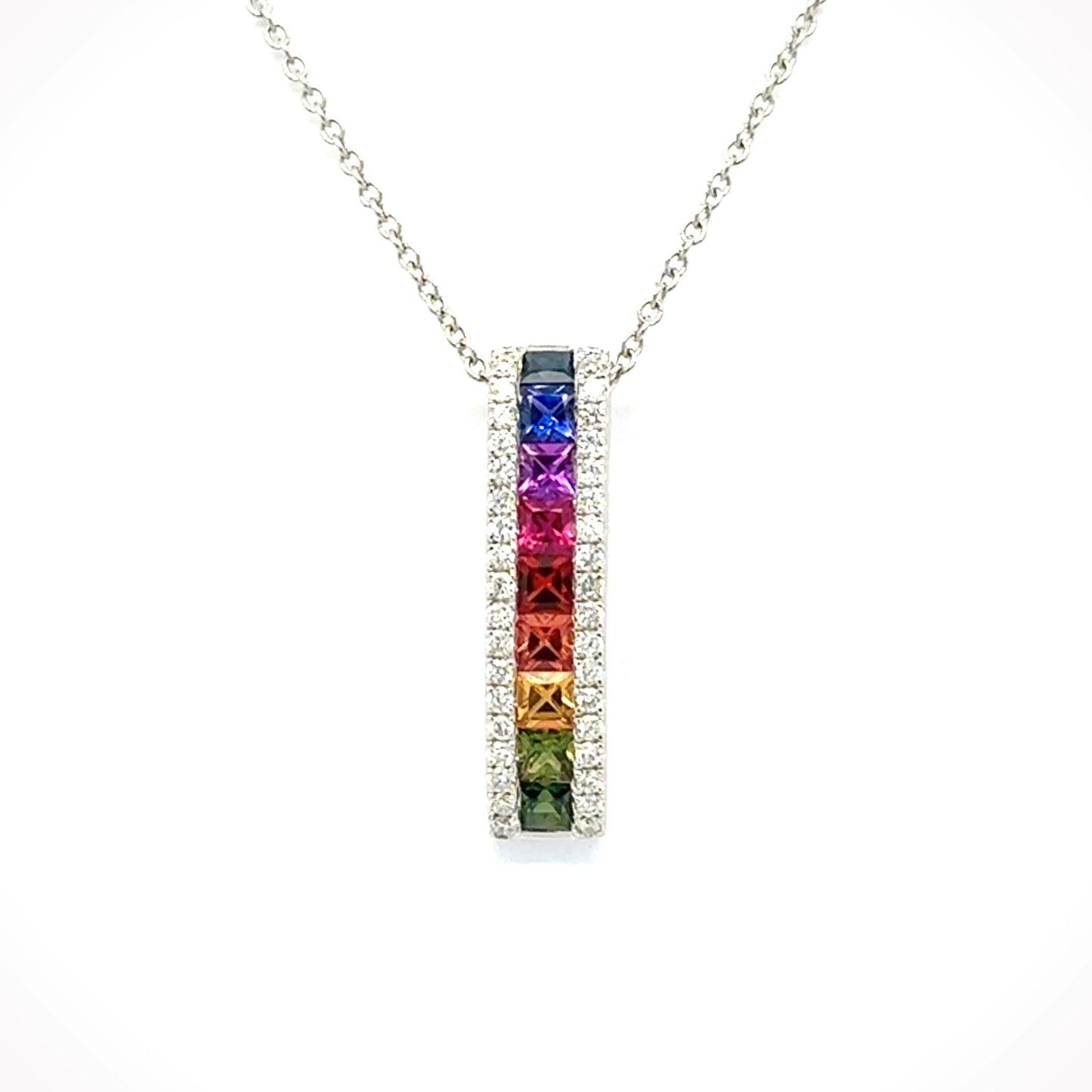 18ct whited gold 'rainbow' square sapphire and brilliant diamond bar slider pendant.