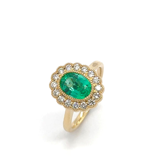 18ct yellow gold oval emerald and brilliant cut diamond floral vintage cluster ring.