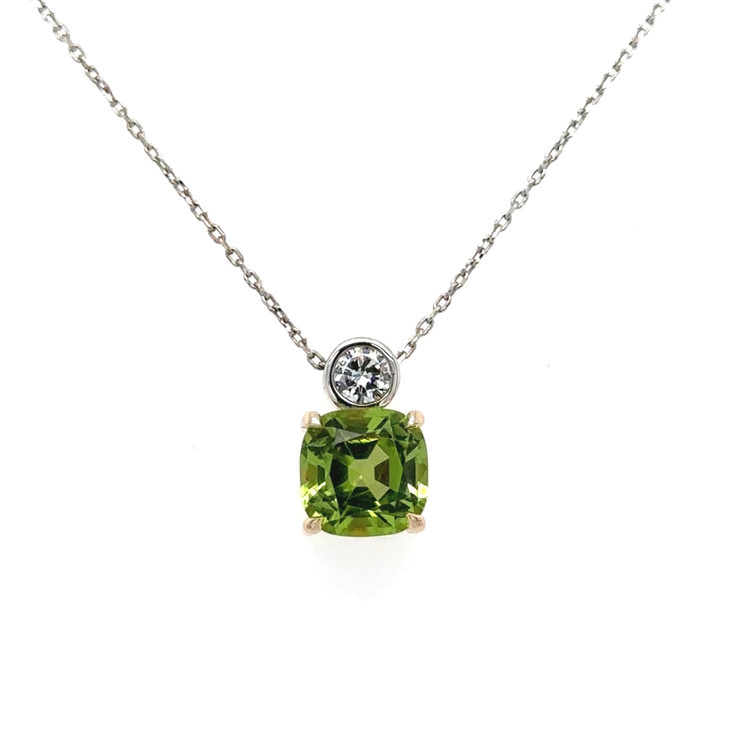 9ct yellow & white gold cushion cut peridot brilliant cut diamond pendant on fine trace chain.